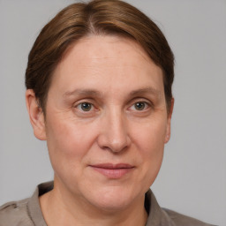 Joyful white adult female with short  brown hair and grey eyes