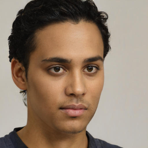 Neutral latino young-adult male with short  brown hair and brown eyes