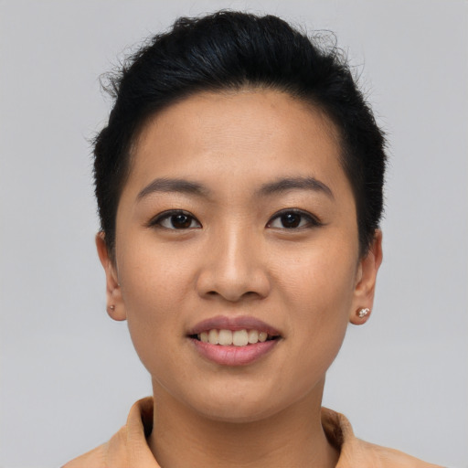 Joyful asian young-adult female with short  black hair and brown eyes