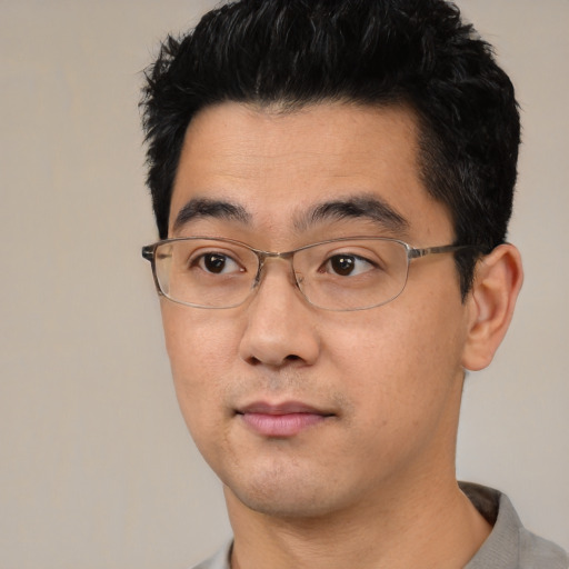 Neutral asian young-adult male with short  black hair and brown eyes