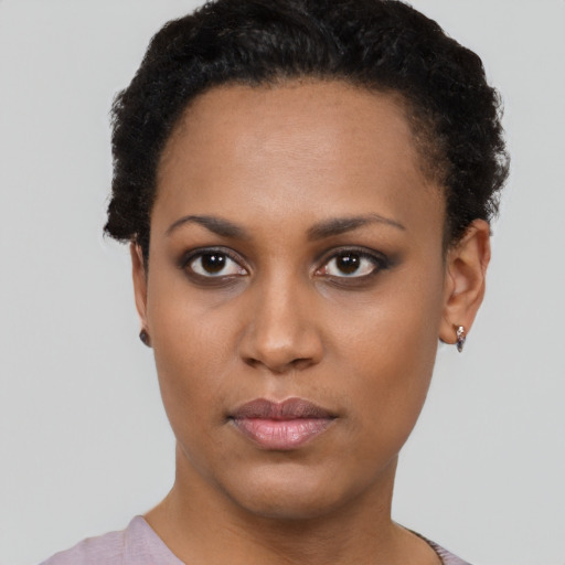 Neutral black young-adult female with short  brown hair and brown eyes
