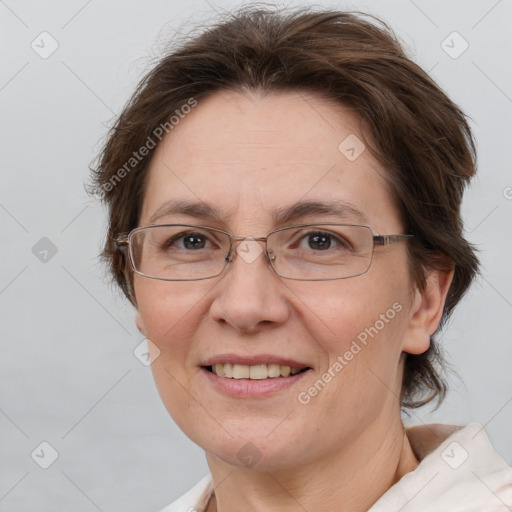 Joyful white adult female with short  brown hair and brown eyes