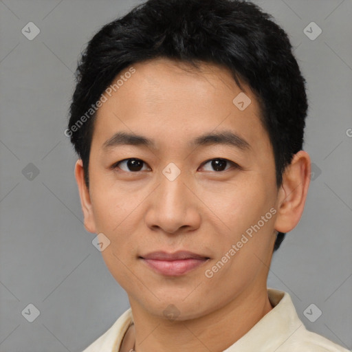 Joyful asian young-adult male with short  black hair and brown eyes