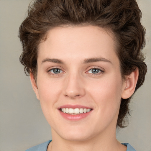 Joyful white young-adult female with medium  brown hair and green eyes