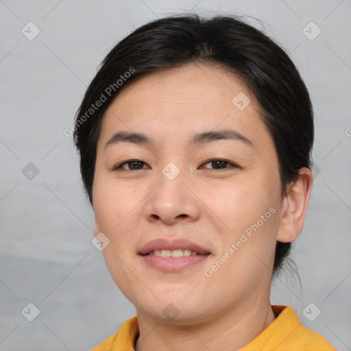 Joyful asian young-adult female with short  brown hair and brown eyes