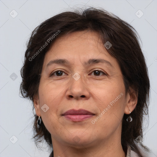 Joyful white adult female with medium  brown hair and brown eyes