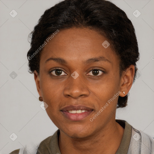 Joyful black young-adult female with short  brown hair and brown eyes