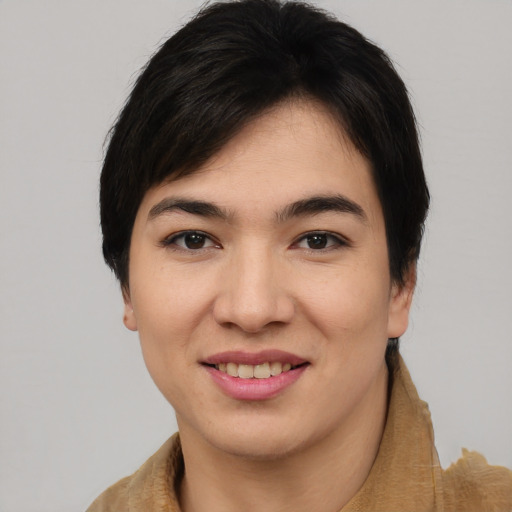 Joyful asian young-adult female with short  black hair and brown eyes