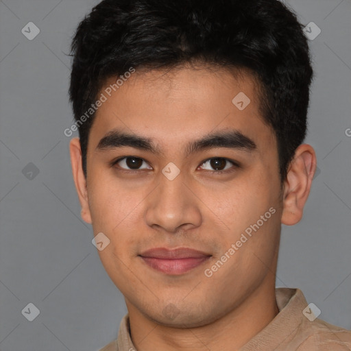 Joyful latino young-adult male with short  brown hair and brown eyes