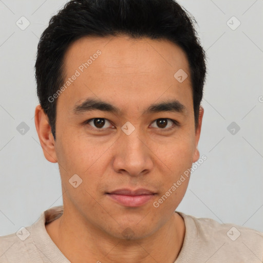 Joyful latino young-adult male with short  brown hair and brown eyes