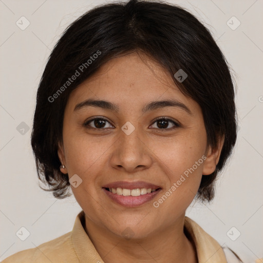 Joyful latino young-adult female with medium  brown hair and brown eyes