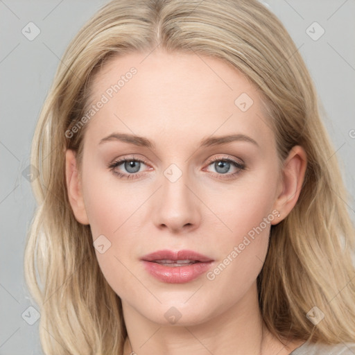 Joyful white young-adult female with long  brown hair and blue eyes