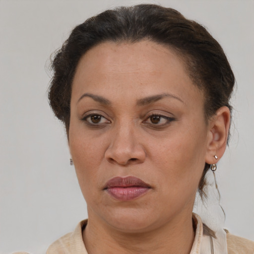 Joyful white adult female with short  brown hair and brown eyes