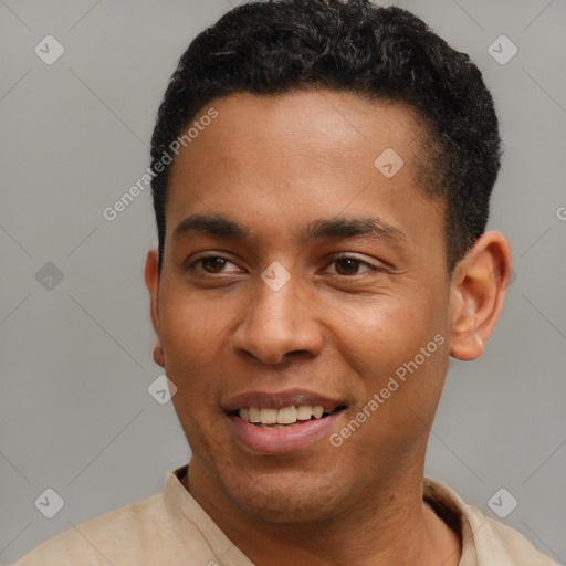 Joyful latino young-adult male with short  black hair and brown eyes