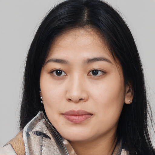 Joyful asian young-adult female with long  black hair and brown eyes