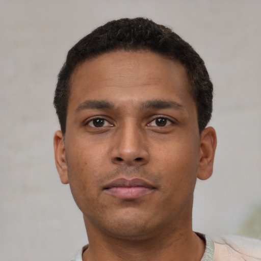 Neutral latino young-adult male with short  brown hair and brown eyes