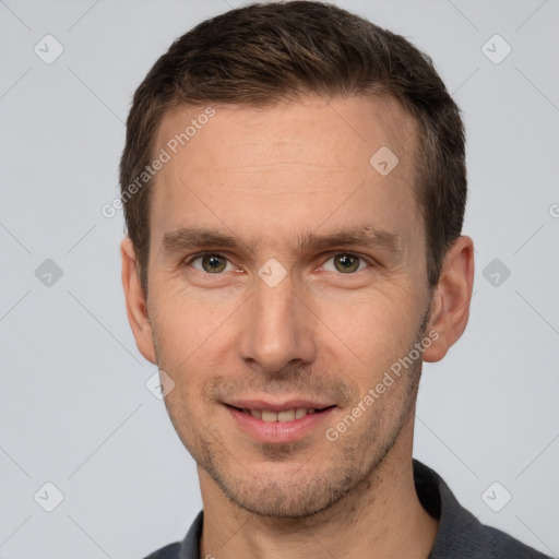 Joyful white adult male with short  brown hair and brown eyes