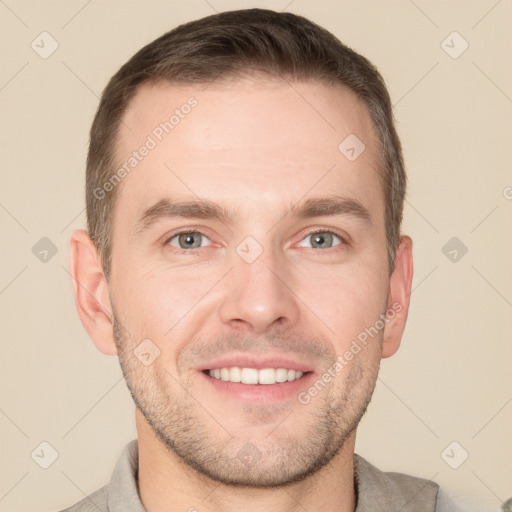 Joyful white adult male with short  brown hair and grey eyes