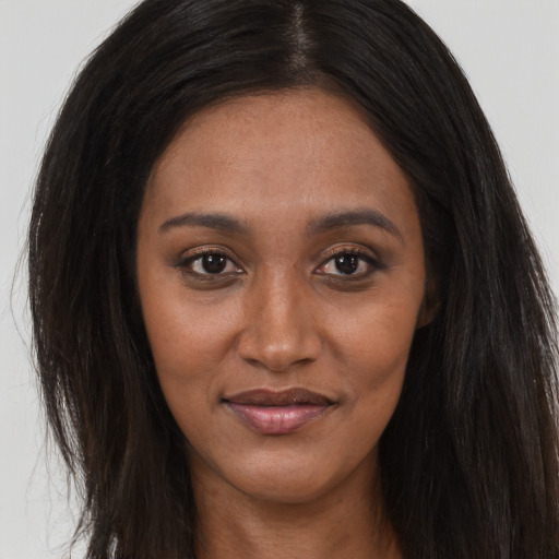 Joyful asian young-adult female with long  brown hair and brown eyes