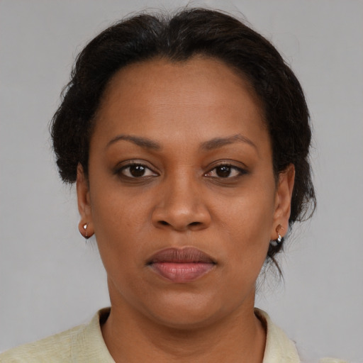 Neutral black adult female with short  brown hair and brown eyes