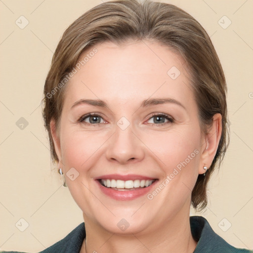 Joyful white young-adult female with medium  brown hair and blue eyes