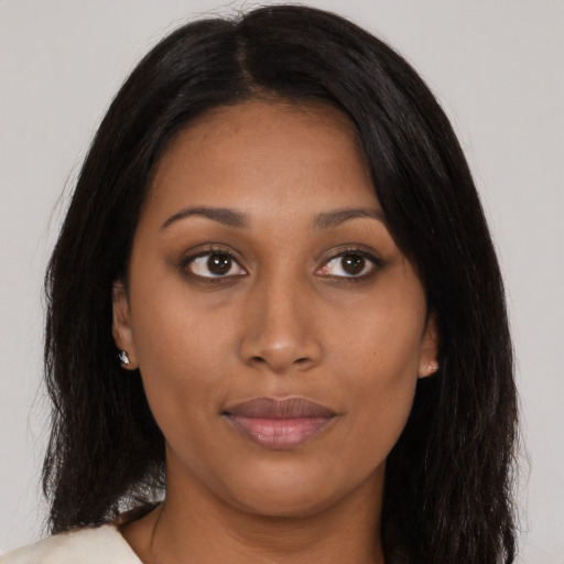 Joyful asian young-adult female with long  black hair and brown eyes