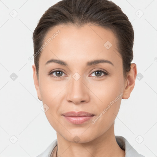 Joyful white young-adult female with short  brown hair and brown eyes