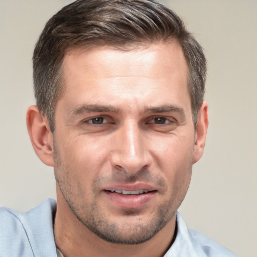 Joyful white adult male with short  brown hair and brown eyes