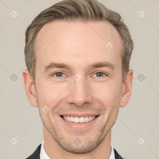 Joyful white adult male with short  brown hair and brown eyes