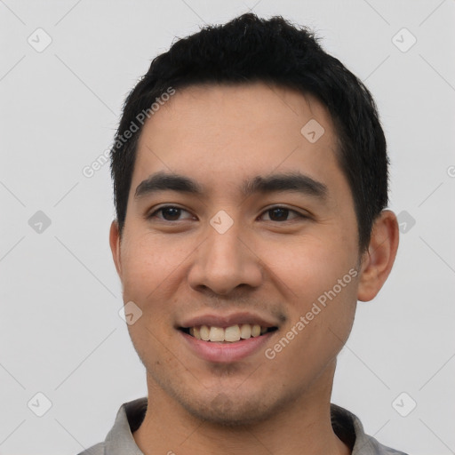 Joyful white young-adult male with short  black hair and brown eyes