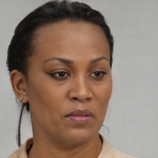 Neutral black adult female with short  brown hair and brown eyes