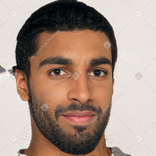 Joyful black young-adult male with short  black hair and brown eyes