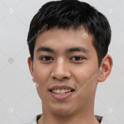 Joyful asian young-adult male with short  black hair and brown eyes