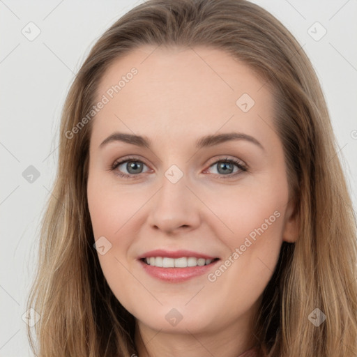 Joyful white young-adult female with long  brown hair and grey eyes