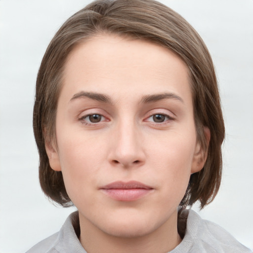 Neutral white young-adult female with medium  brown hair and grey eyes