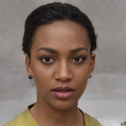 Neutral black young-adult female with short  brown hair and brown eyes