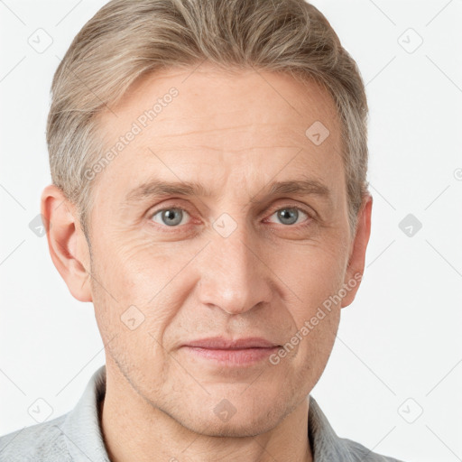 Joyful white adult male with short  brown hair and grey eyes