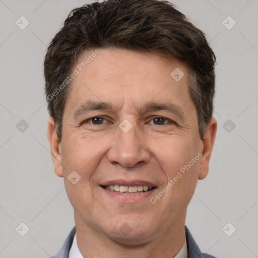 Joyful white adult male with short  brown hair and brown eyes