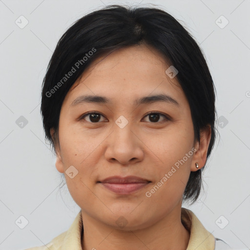 Joyful asian young-adult female with medium  brown hair and brown eyes