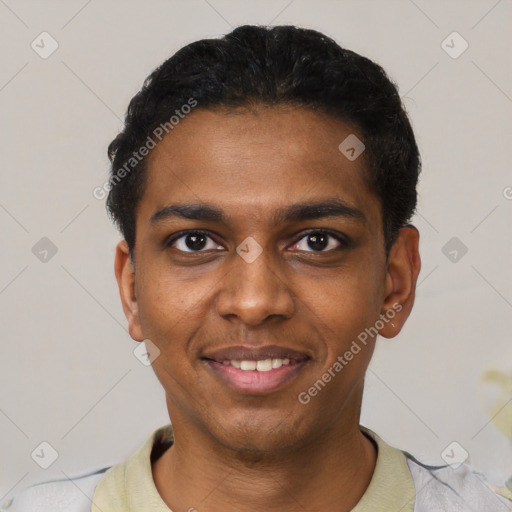 Joyful black young-adult male with short  black hair and brown eyes