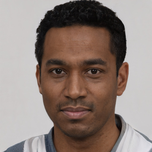 Neutral black young-adult male with short  black hair and brown eyes