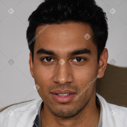 Joyful white young-adult male with short  black hair and brown eyes