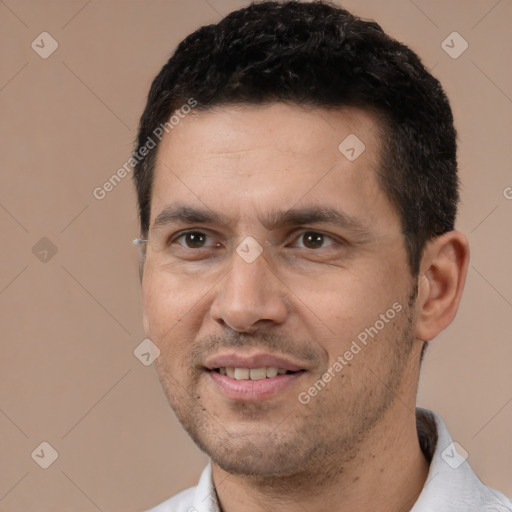 Joyful white young-adult male with short  black hair and brown eyes