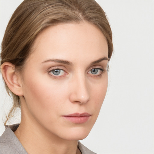 Neutral white young-adult female with medium  brown hair and grey eyes