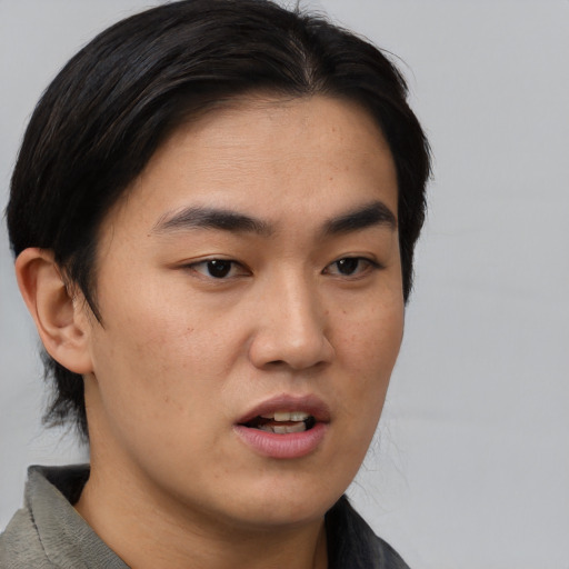 Neutral asian young-adult male with short  brown hair and brown eyes