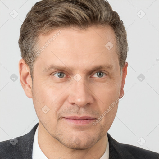 Joyful white adult male with short  brown hair and grey eyes