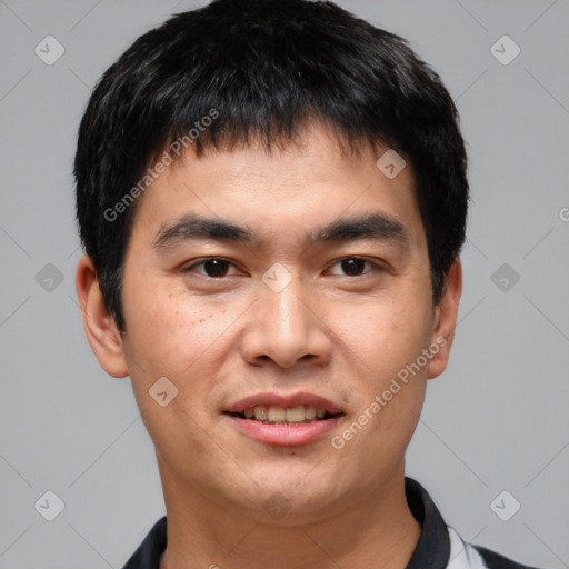 Joyful white young-adult male with short  black hair and brown eyes