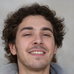 Joyful white young-adult male with medium  brown hair and brown eyes