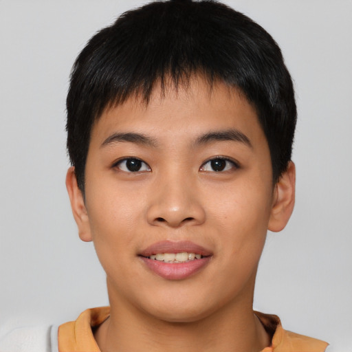 Joyful asian young-adult male with short  brown hair and brown eyes