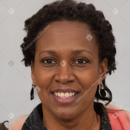 Joyful black adult female with short  brown hair and brown eyes